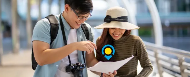 Couples Traveling Together Checking their Itinerary