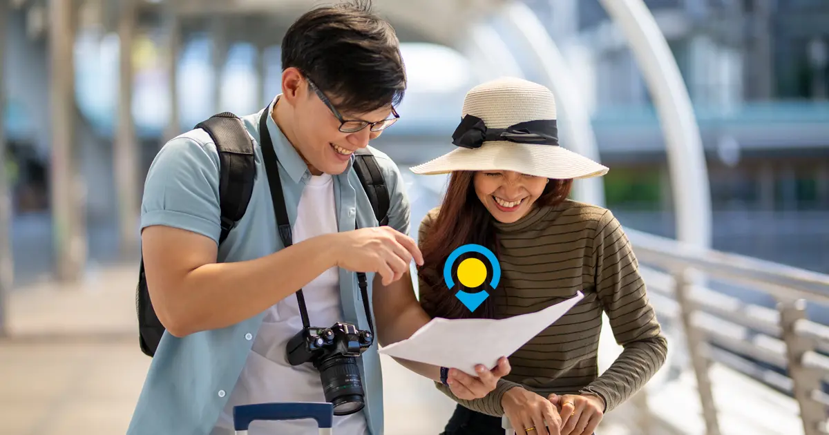 Couples Traveling Together Checking their Itinerary